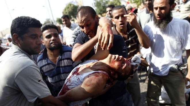 Supporters of Morsy kill a demonstrator and throw his body in a garbage dump